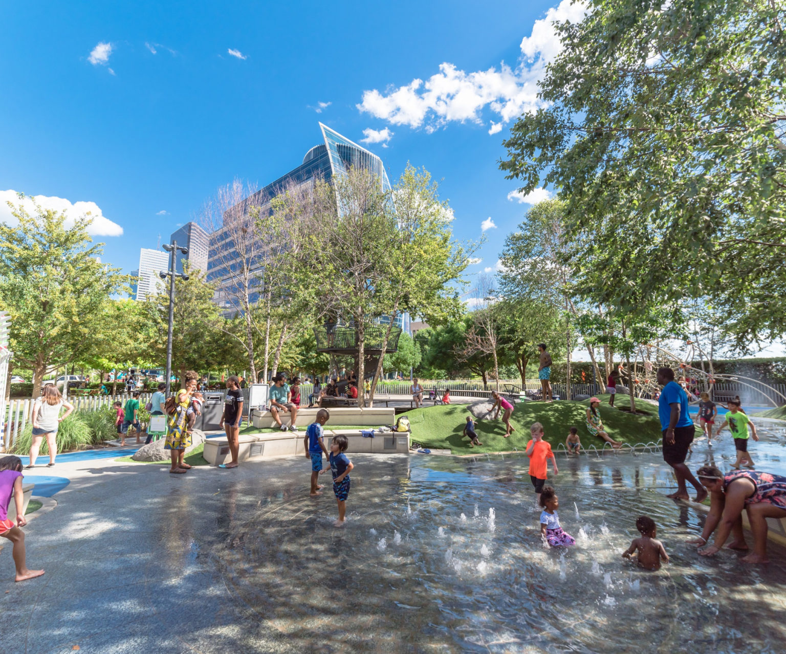Kids playing in water fountain
